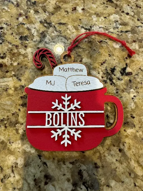 Family name ornament with a hand-painted hot cocoa mug design